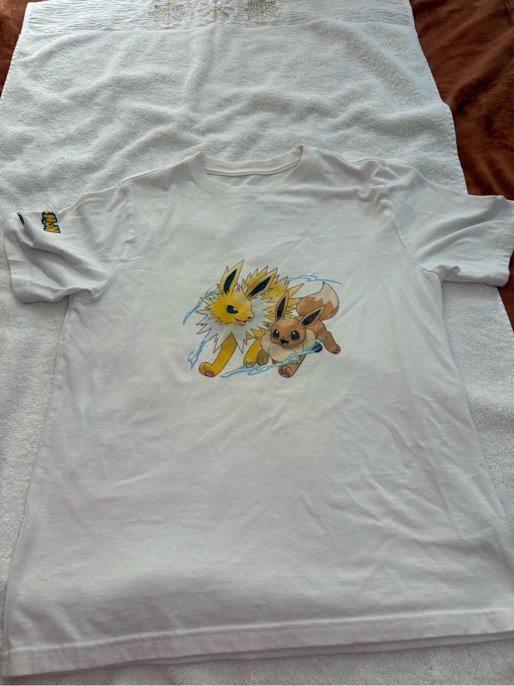 wonder nation White T-Shirt with pokemon and Eevee Graphic